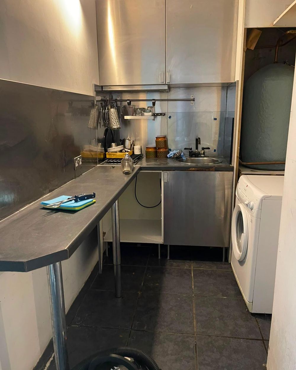 The same kitchen after cleaning: clear worktops, clean units and a clear floor